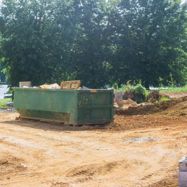 A picture showing a construction rolloff dumpster.