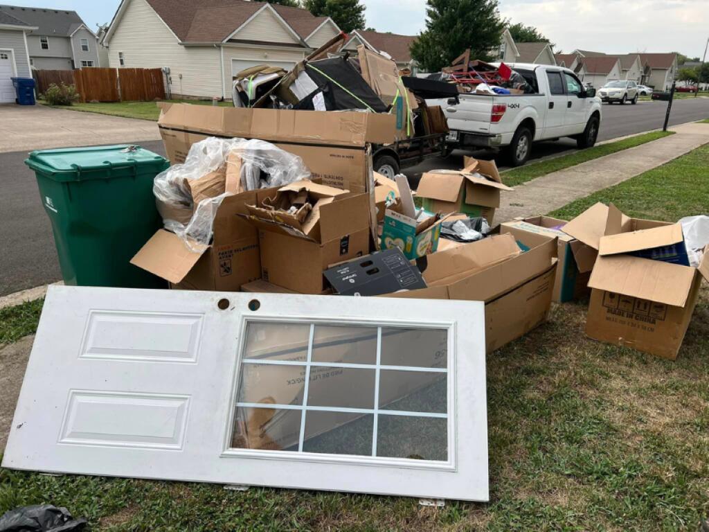 An image of homeowners after junk removal provided by Lil Feller Removal, one of the best local junk removal companies.